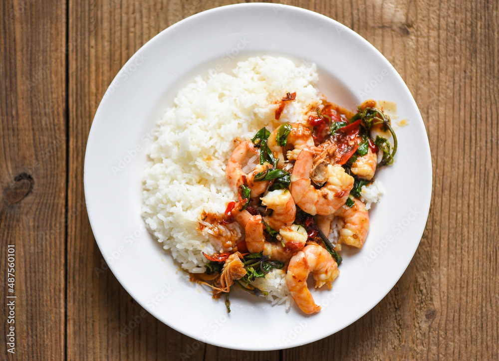 Stir fried shrimp, Cooked rice and fried basil with shrimps prawns,Thai food rice topped shrimp with holy basil leaves