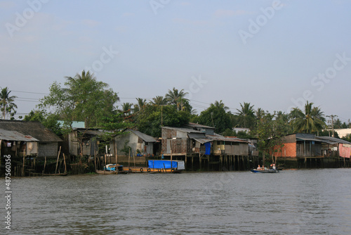 village and slum along a river in the mekong delta in south vietnam 