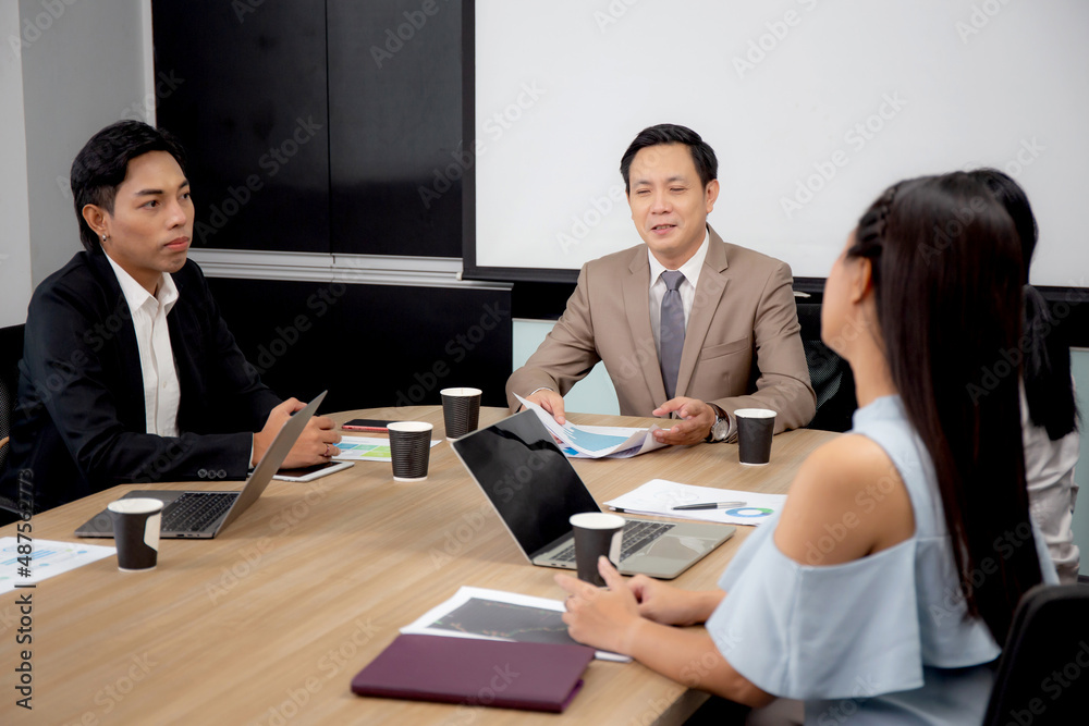 Group of team young business and executive discussing for planning marketing and strategy of financial at the office, manager and employee meeting for seminar about finance, at the conference room. Group of team young business and executive discussing for planning marketing and strategy of financial at the office, manager and employee meeting for seminar about finance, at the conference room.