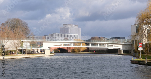 Berlin, Germany, February 5, 2022, view over the river Spree to the Chancellery footbridge with Charite and cloudy sky in the background photo