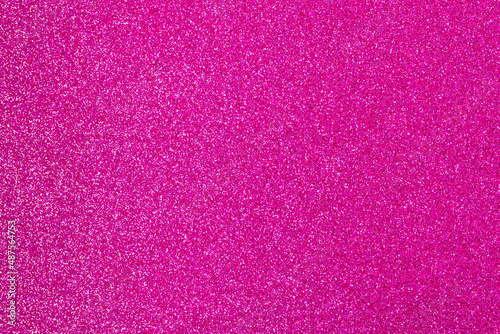 Pink wrapping paper background with a metallic sheen, copy space. Fashion texture, minimal concept, flat lay, top view