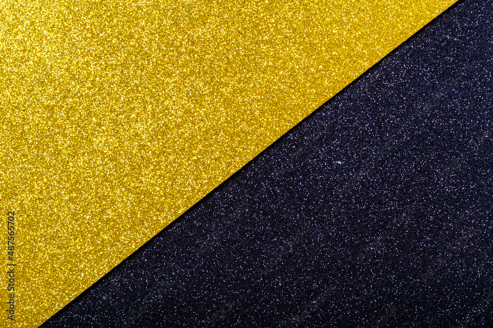 Yellow and black wrapping paper background with a metallic sheen. Double color yellow black shiny paper background Yellow and black wrapping paper background with a metallic sheen. Double color yellow black shiny paper background