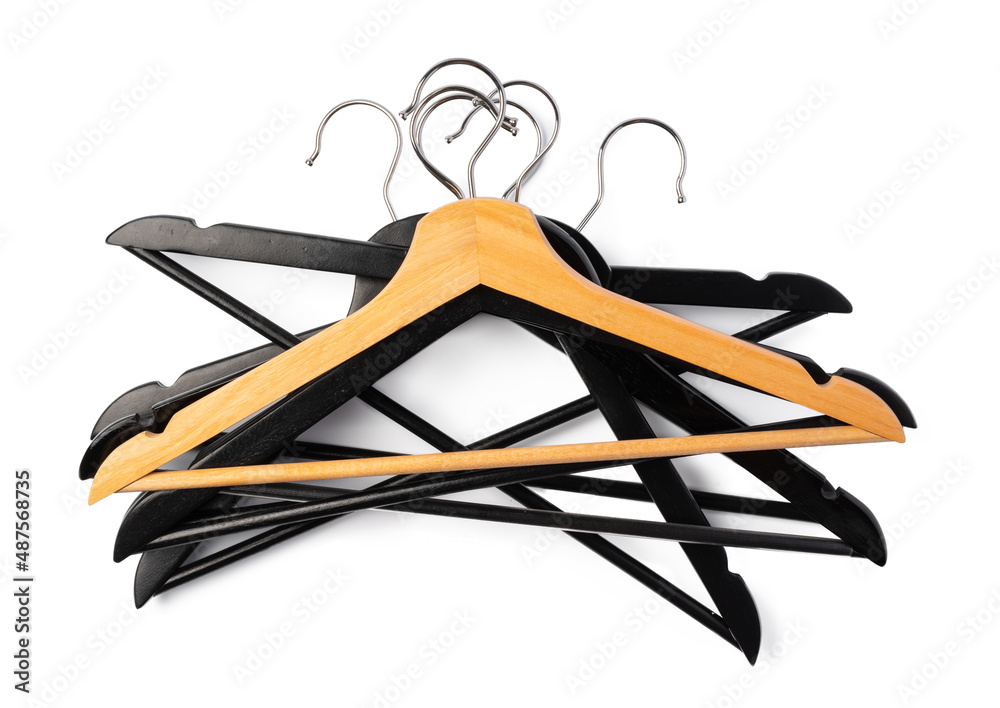 a pile clothes hangers on isolated white background a pile clothes hangers on isolated white background