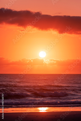 Gold coast beach colourful orange sky with clouds at sunrise