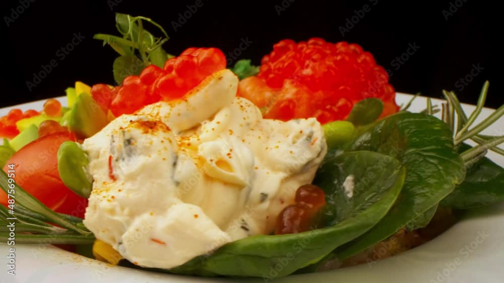 Healthy food concept. Fresh fish, red caviar. Olive oil salad dressing with red caviar and young shoots of peas. Business lunch. veganism raw food concept Healthy food concept. Fresh fish, red caviar. Olive oil salad dressing with red caviar and young shoots of peas. Business lunch. veganism raw food concept