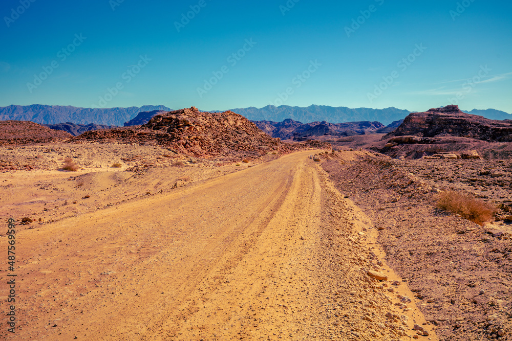 Mountain desert landscape. Dirt road in Timna Park, Eilat, Israel