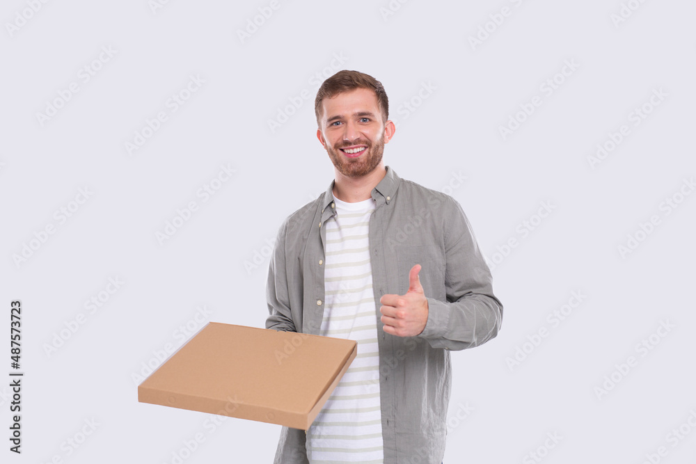 Man Holding Pizza Box Showing thumb Up Isolated. Fast Food, Unhealthy food Concept Isolated Man Holding Pizza Box Showing thumb Up Isolated. Fast Food, Unhealthy food Concept Isolated