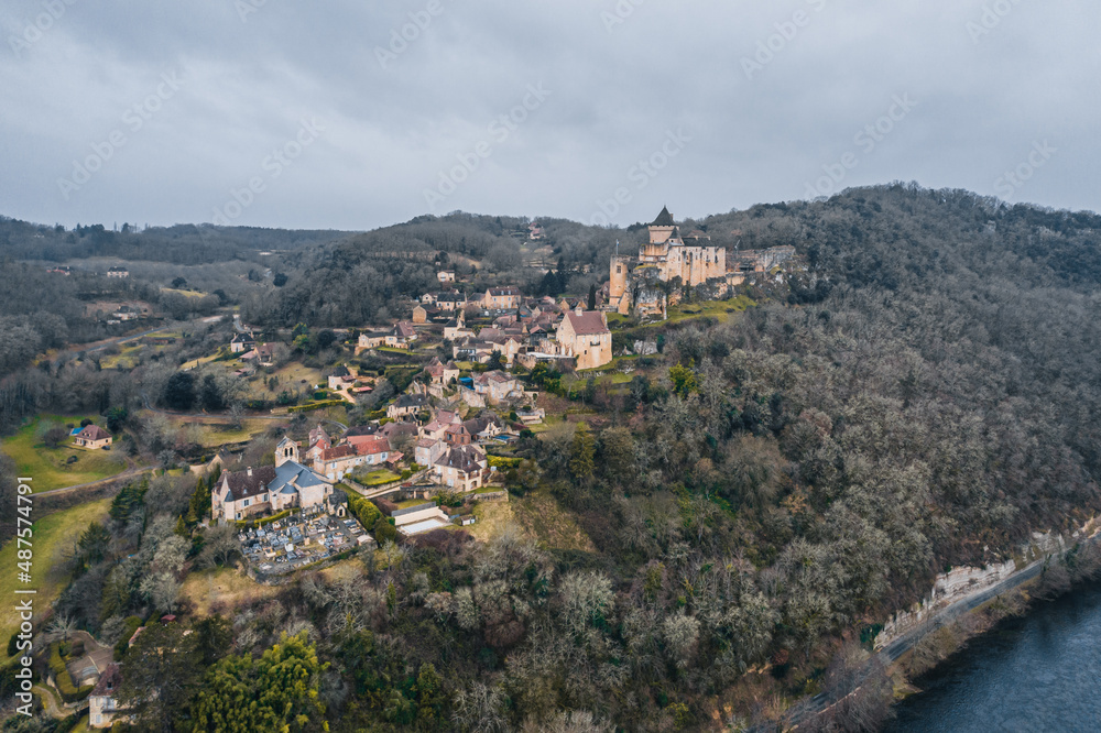 Aerial view of an ancient medieval French village and Castelnaud-la-Chapelle Castle on the mountain in France