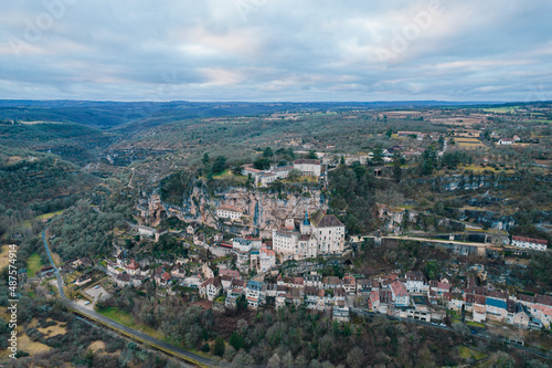 Aerial view of an ancient french village and its castle on cliff, Rocamadour at dusk