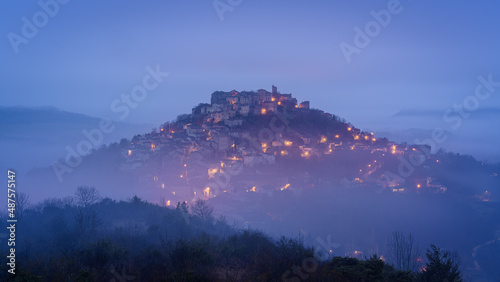 The fortified medieval town of Cordes sur Ciel in Occitanie at sunrise with  photo