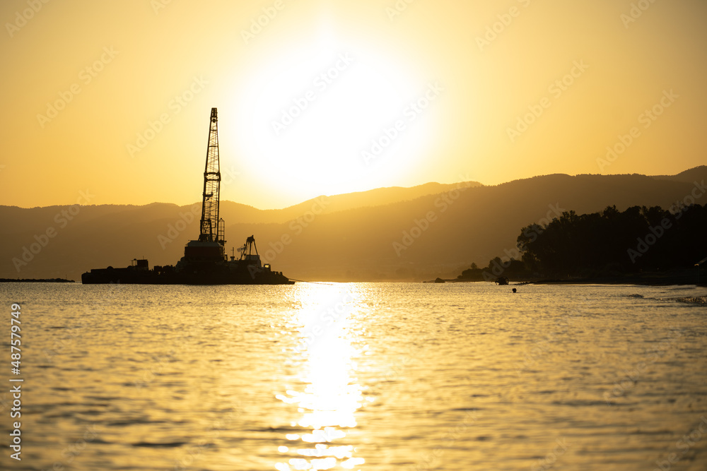 Naklejka premium Industrial beach in sunrise