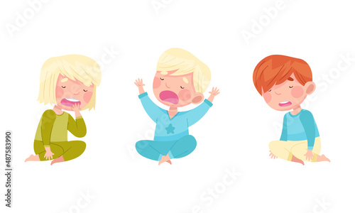 Sleepy Little Boy and Girl Wearing Pajamas Sitting and Yawning Vector Illustration Set