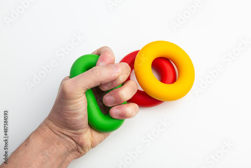 Bild auf Leinwand hand expander in the form of colored rubber rings of different density