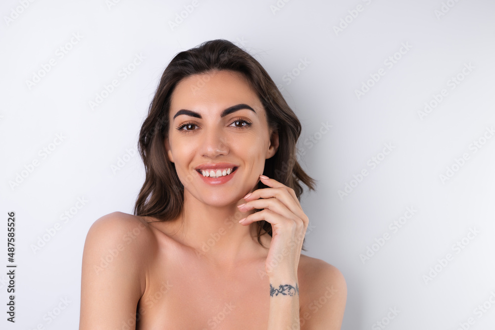 Close-up beauty portrait of a topless woman with perfect skin and natural make-up Close-up beauty portrait of a topless woman with perfect skin and natural make-up