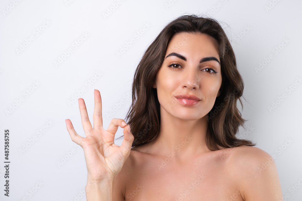 Close-up beauty portrait of a topless woman with perfect skin and natural make-up Close-up beauty portrait of a topless woman with perfect skin and natural make-up