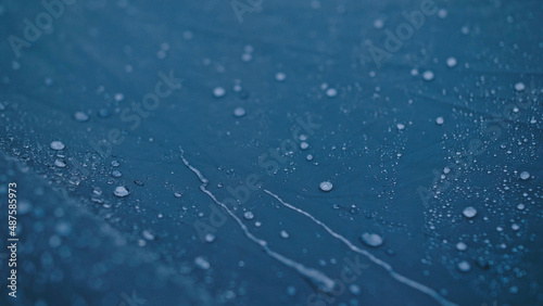 Photography Close-up shot of raindrops water droplets on the tent