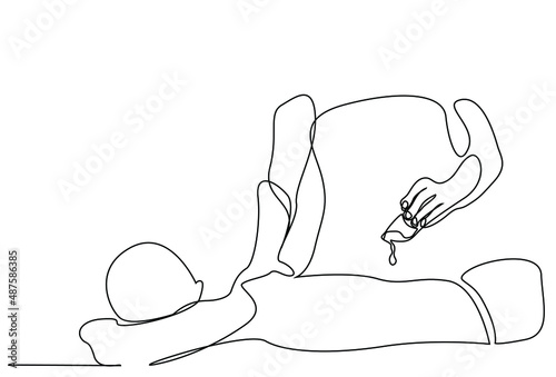 massage spa worker pours massage oil on the lying person and starts therapy