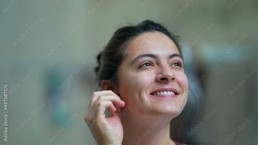 Happy casual woman in 30s smiling person looking at sky feeling satisfied