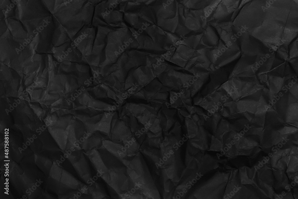black crumpled paper texture as background black crumpled paper texture as background