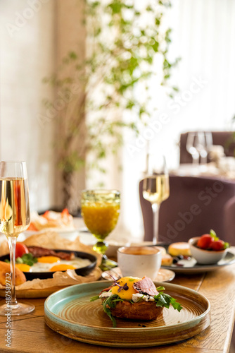 breakfast table with a variety of dishes and drinks