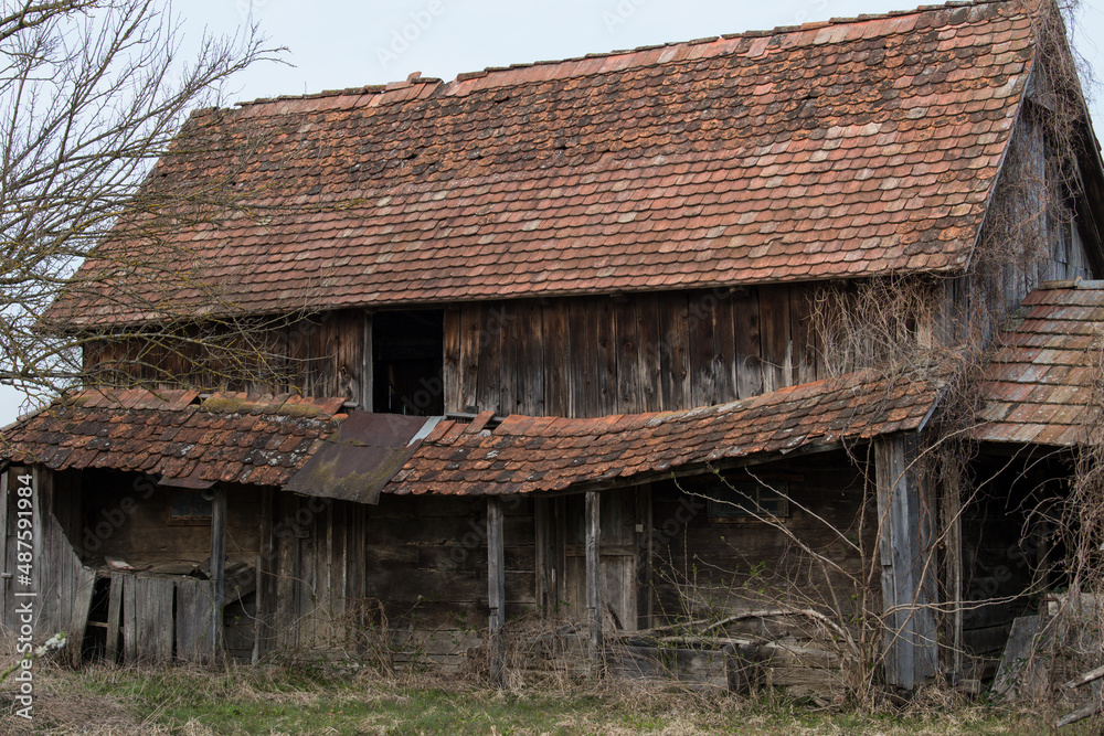 Sunja, Croatia, 05,04,2021: Abandoned traditional old wooden house.
Sunja, Croatia, 05,04,2021: Abandoned traditional old wooden house.