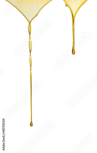 Olive or engine oil dripping on white background
