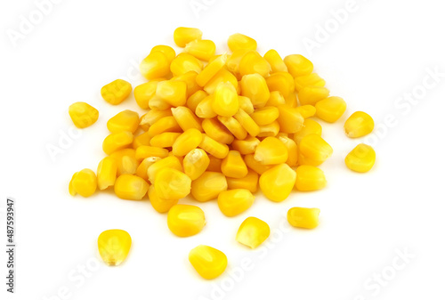 Heap of yellow sweet corn seeds isolated on white background