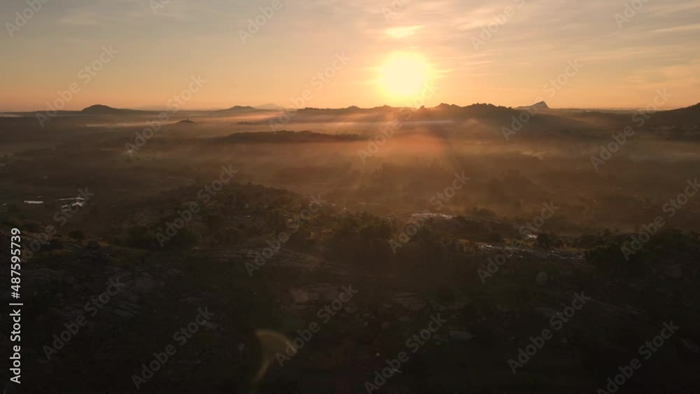 Aerial panning shot of Beautiful sunset in western ghats mountain range in India Aerial panning shot of Beautiful sunset in western ghats mountain range in India