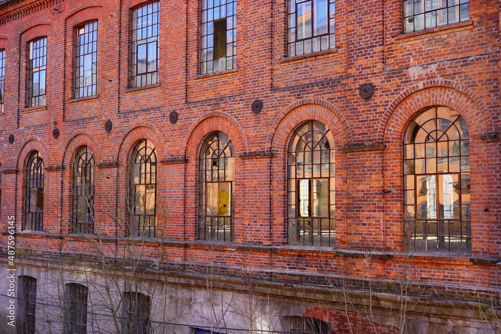 Old red brick factory, old architecture of the city of Lodz, Poland. Abandoned factory 