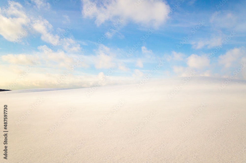 Beautiful empty winter landscape. White plains, fields and meadows on a frosty sunny day. Calm polar background for design and tourist advertising Beautiful empty winter landscape. White plains, fields and meadows on a frosty sunny day. Calm polar background for design and tourist advertising