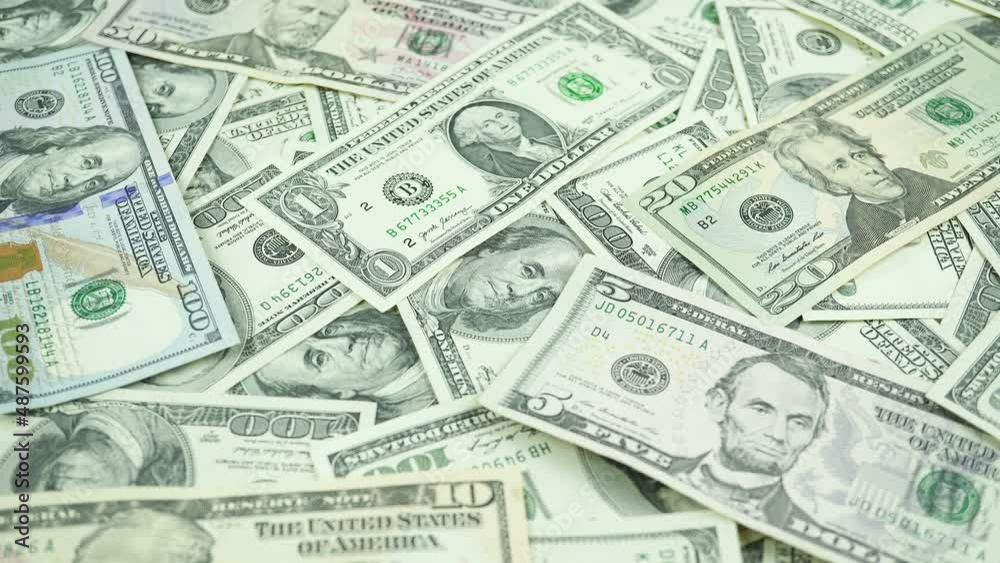 Dollar Bills Of Different Denominations On The Table. 