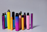 electronic cigarettes are multicolored. Background for text or vape liquid advertising