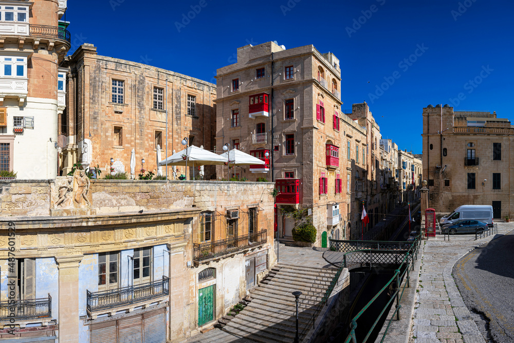 Footbridge and narrow street with stairs in Valletta, Malta.