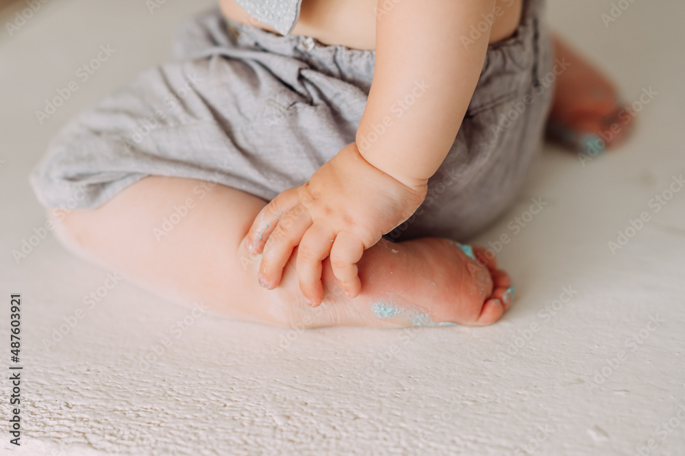 A one-year-old baby is sitting on the floor 4240. A one-year-old baby is sitting on the floor 4240.