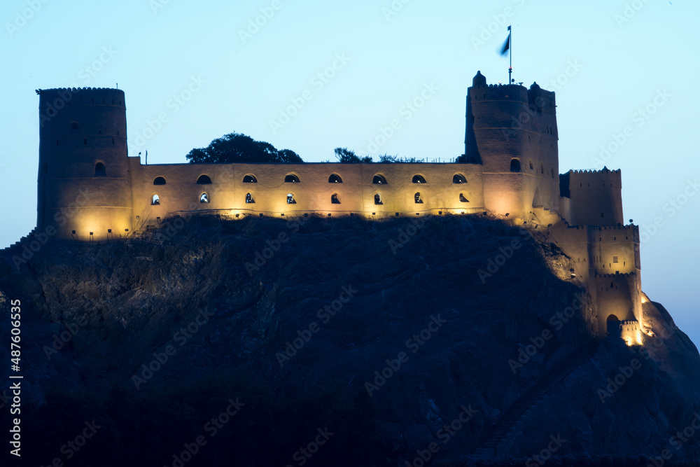 Fototapeta premium Muscat,Oman - March 05,2019 : View of the Al Jalali fortess at sunrise in the old town of Muscat. 