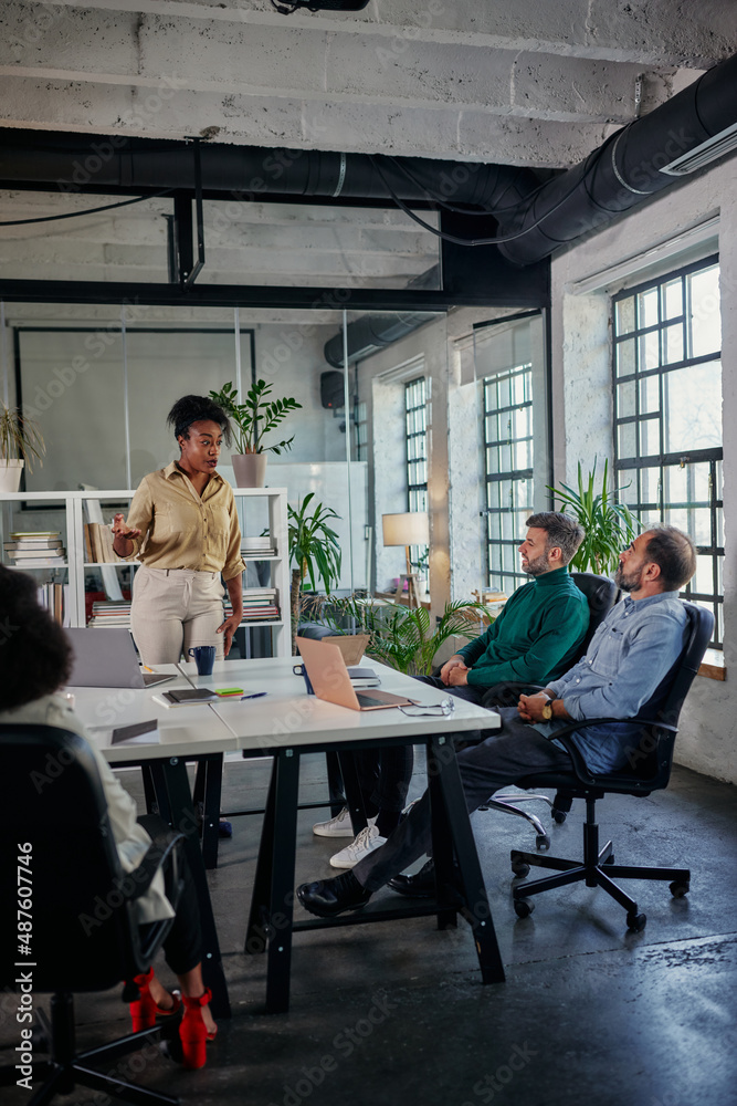 Multiracial businesspeople on a meeting in boardroom Multiracial businesspeople on a meeting in boardroom