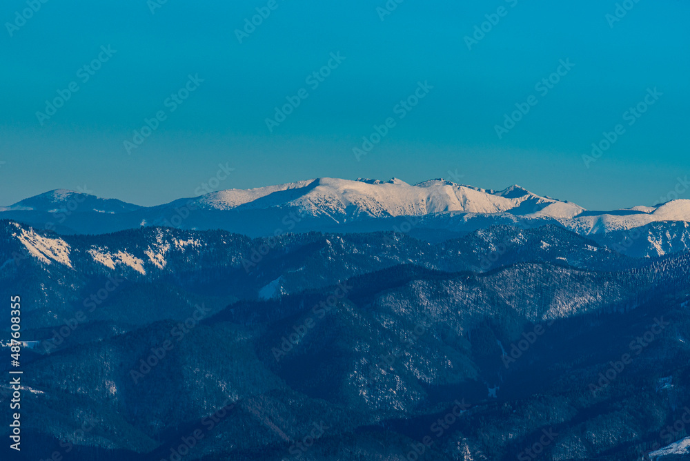 Highest part of Nizke Tatry mountains with Dumbier and Chopok mountains peaks from Mincol hill in winter Mala Fatra mountains in Slovakia