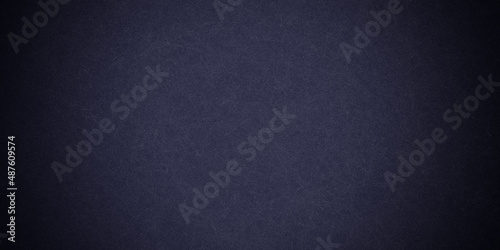 Dark blue background texture with black vignette in old vintage grunge textured border design, dark elegant teal color wall with light 