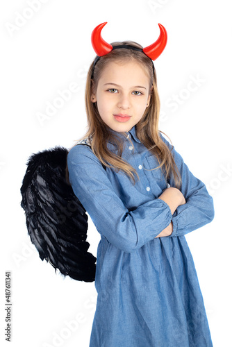 Cute little girl with a davil costume photo