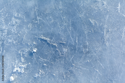 Fotografie Empty ice rink with skate marks after the session outdoor