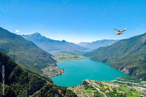 seaplane in flight over lake of Novate Mezzola in Valchiavenna, Italy