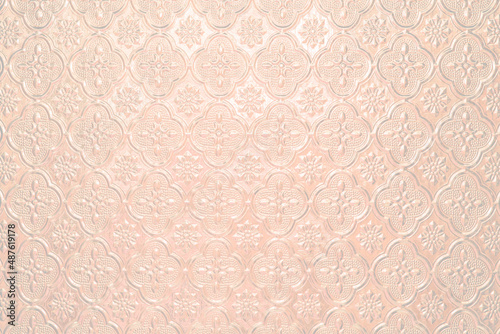 Textured pale pink light faded background with a pattern, painted glass in vintage style wall