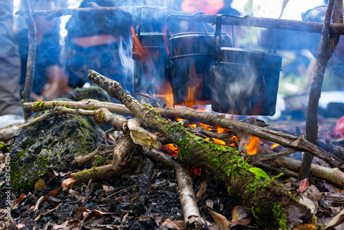 Cooking food at the stake outdoors scene, fire iron pot camping tourism, 