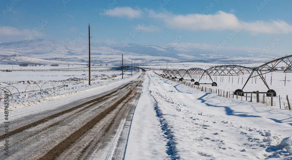 Snowy road in the farmlands of Idaho