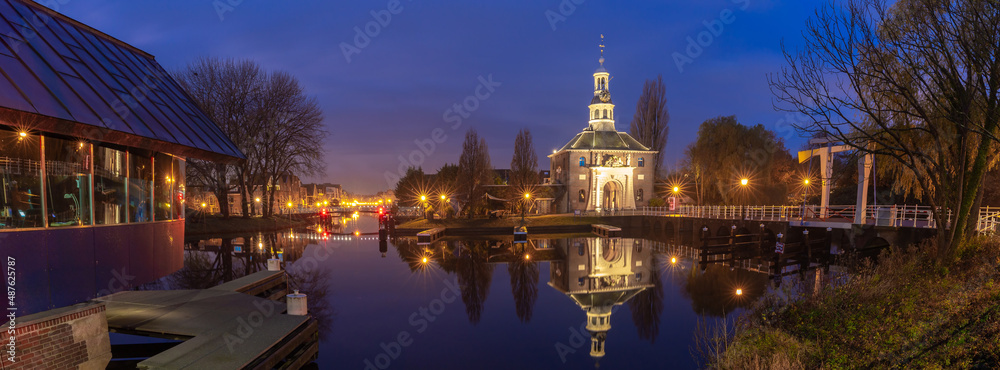 The old city gate Zijlpoort in Leiden at sunrise.