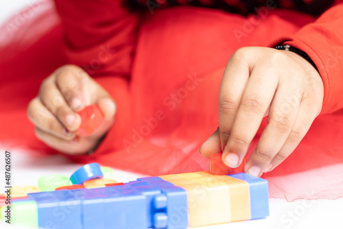 Nimble fingers Of Infant Toddler Kid Playing With Multicolored Building Blocks. Fun  Activity  Pre School  Educational  Kindergarten  Learning  Home Activity  School  Nursery  Daycare Concept