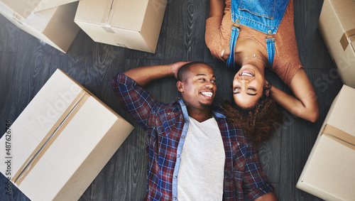 Completely happy at their new place. Shot of an attractive young couple moving house.