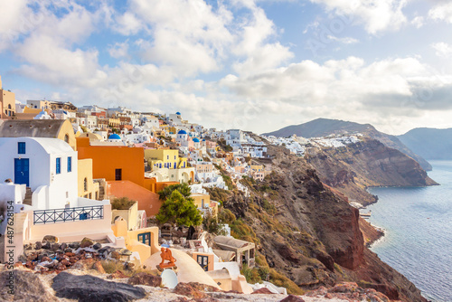 houses on cliff of Oia town at sunset in Santorini, Greek islands, Greece