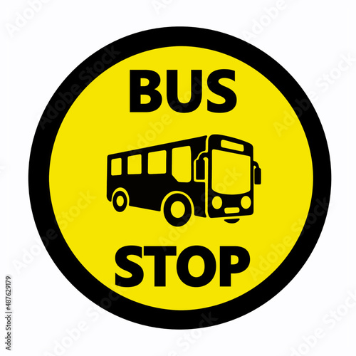Bus stop sign. Yellow round shape with text and silhouette