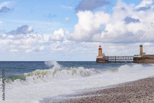 Lighthouses and guidance at the entrance of the Port of Fecamp, Normandy, France, Europe on the coast of Normandy in the English Channel in Autumn. Seascape with waves. photo